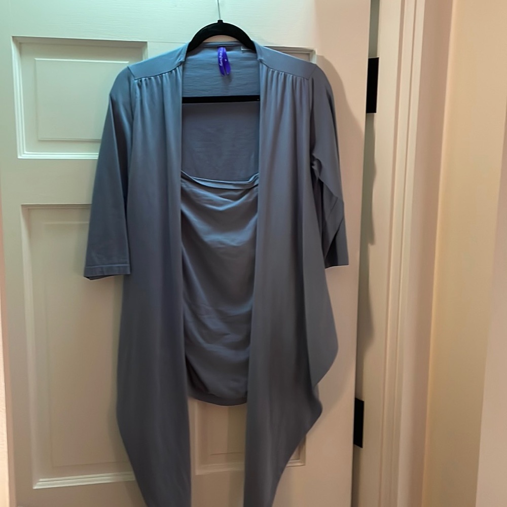 Seraphine baby wearing shirt. Excellent condition.
